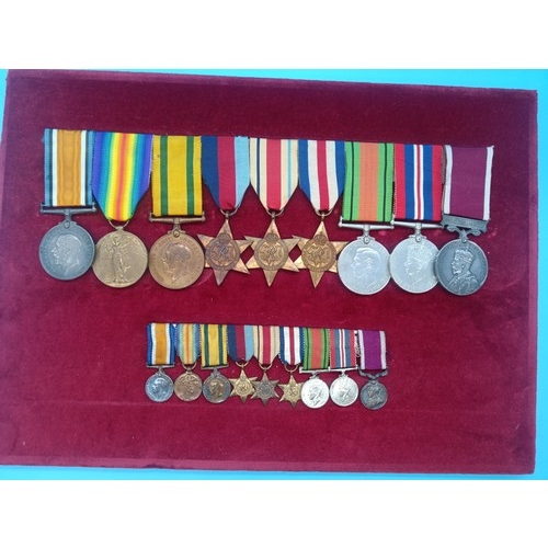 390 - A WW2 Medal Group and Miniatures. Framed. War Medal, Defence Medal, France and Germany Star, Africa ... 