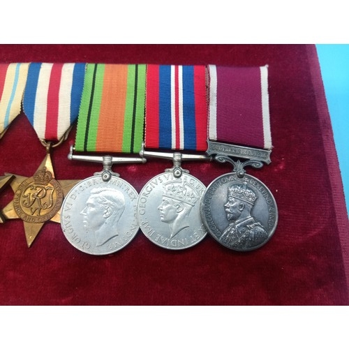 390 - A WW2 Medal Group and Miniatures. Framed. War Medal, Defence Medal, France and Germany Star, Africa ... 