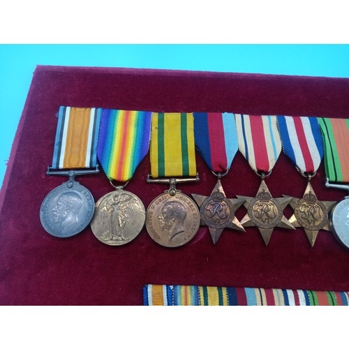 390 - A WW2 Medal Group and Miniatures. Framed. War Medal, Defence Medal, France and Germany Star, Africa ... 