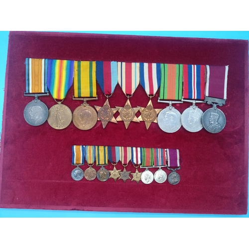 390 - A WW2 Medal Group and Miniatures. Framed. War Medal, Defence Medal, France and Germany Star, Africa ... 