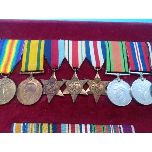 390 - A WW2 Medal Group and Miniatures. Framed. War Medal, Defence Medal, France and Germany Star, Africa ... 