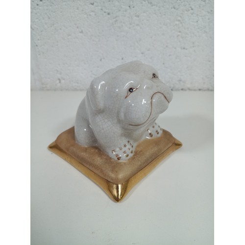 589B - A Porcelain Lounging Bulldog on a Cushion 10 x 10 x 9cm