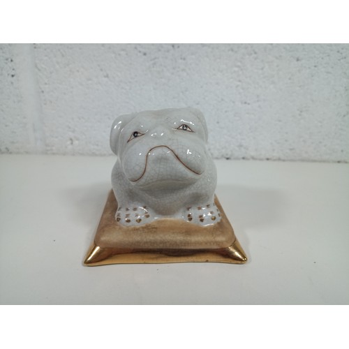 589B - A Porcelain Lounging Bulldog on a Cushion 10 x 10 x 9cm