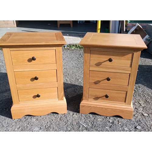 703C - A Pair of John Lewis Oak Bedside Tables