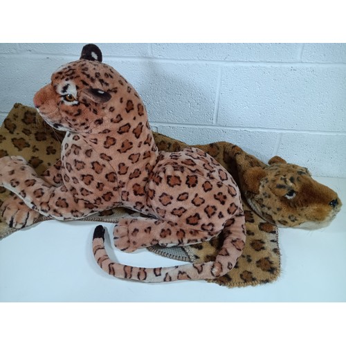 878 - A Toy Leopard and Mock Leopard Skin Rug