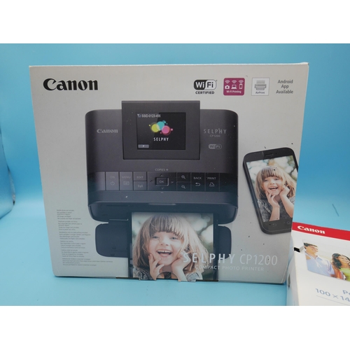 703 - A Boxed & Unused Canon Selphy CP1200 Wireless Photo Printer and Case (not pictured)
.