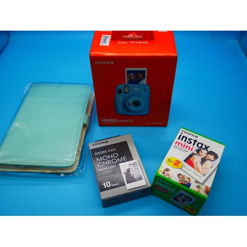 713 - An Intax Mini 11 & Films - Boxed & Unopened.