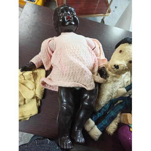 581E - A Black Doll and Other Cuddly Toys