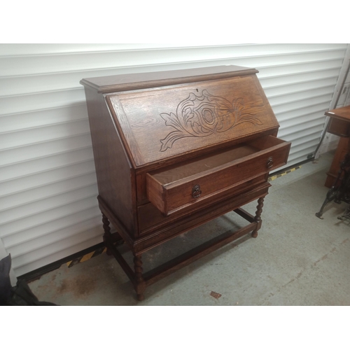 858 - An Oak Bureau with Carved Front, Barley Twist Legs and a Leather Writing Top 108cm H x 96cm W x 46cm... 