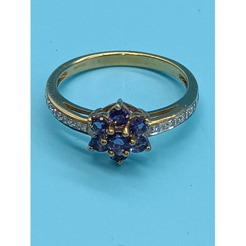 404 - A 9ct Yellow Gold Tanzanite Daisy Ring with Diamond Shoulder Size N/O