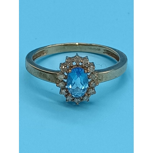 456 - A 9ct Yellow Gold and Blue Topax and Diamond Daisy Ring 1.8 Grams , Size N/O