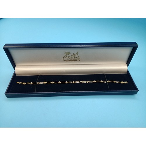 470 - A 9ct Diamond and Yellow Gold Bracelet