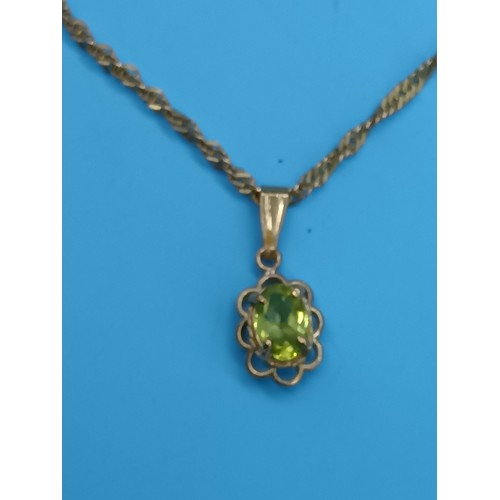 414 - A 9ct Yellow Gold and Peridot Necklace and Pendant