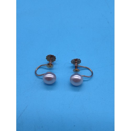 454 - A Pair of 9ct Gold and pearl screw clasp earrings