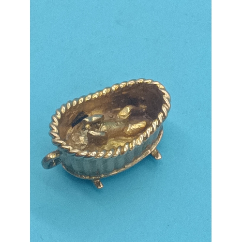 438 - A 9ct Gold Charm  - Baby and Bathwater - 3.5 grams