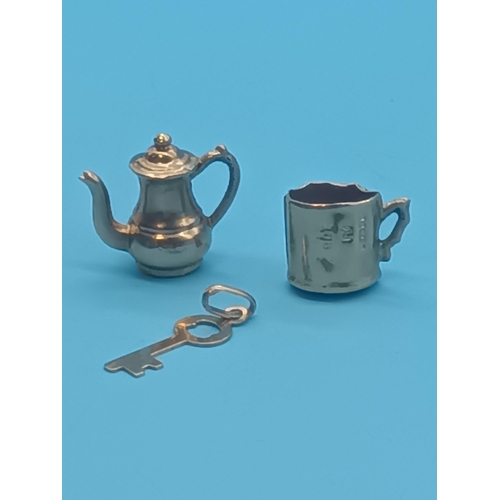 442 - A 9ct Gold Charm  - Key, Tankard and Coffee Pot  - 1.23 grams