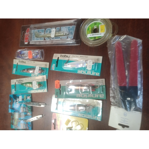 103 - Mixed Box Of Fishing Lures, Many In Sealed Packets, Shads Sandeels, & Many More.