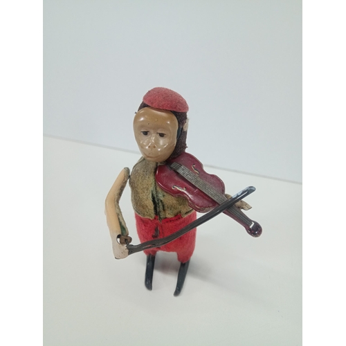 664 - A Vintage Schuco Clockwork Tin Toy Monkey playing a violin - Working