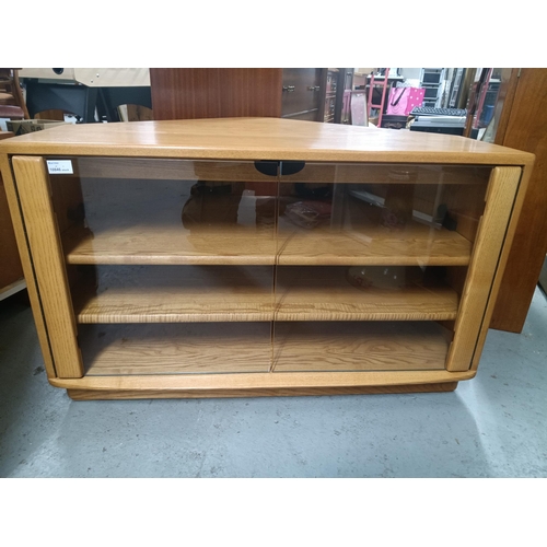 660 - An Ercol corner T.V entertainment unit 2 Shelves Glass doors 55cm H x 92W x 71D