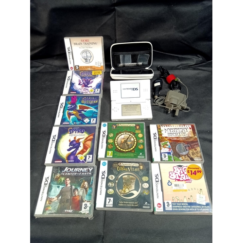 305C - A White Nintendo DS Lite with 9 x Games and Acessories