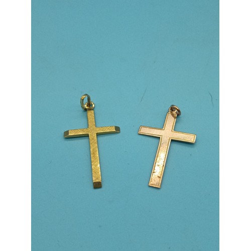 447 - A 9ct Yellow Gold Cross 1.1grams and another Hallmarked but tested 9ct Gold Cross 1.6grams