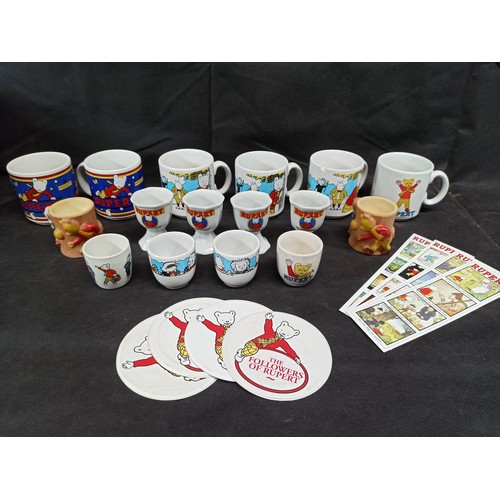 563 - A Collection of Rupert the Bear Mugs and Eggs Cups etc,