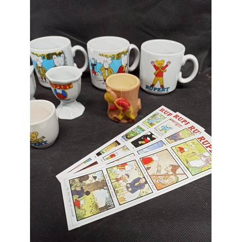 563 - A Collection of Rupert the Bear Mugs and Eggs Cups etc,