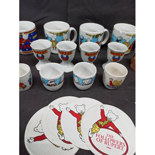 563 - A Collection of Rupert the Bear Mugs and Eggs Cups etc,