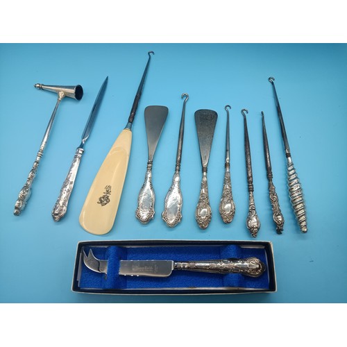 507C - A Collection of Hallmarked Silver Button Hooks, Shoe Horns and Silver Handled Cheese Knife