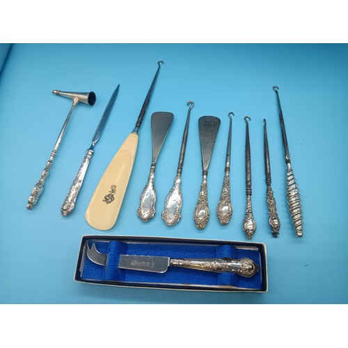 507C - A Collection of Hallmarked Silver Button Hooks, Shoe Horns and Silver Handled Cheese Knife