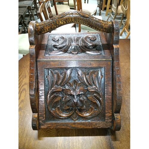 895A - An Handsome Antique Victorian Gothic Revival Coal Scuttle in Oak with Green Man Carved Front Circa 1... 