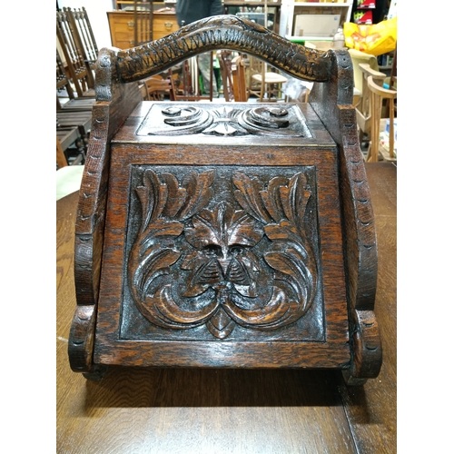 895A - An Handsome Antique Victorian Gothic Revival Coal Scuttle in Oak with Green Man Carved Front Circa 1... 