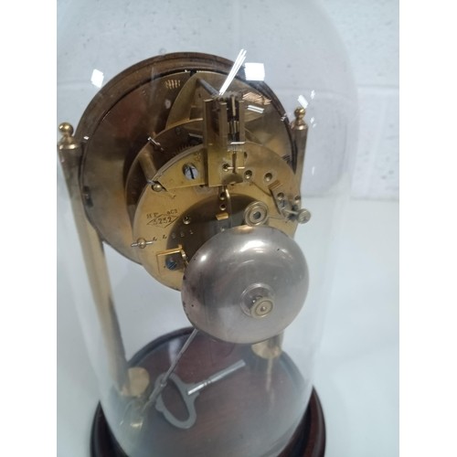 667H - A Skeleton Clock under a Glass Dome - Runs but stops after an hour - needs attention or service