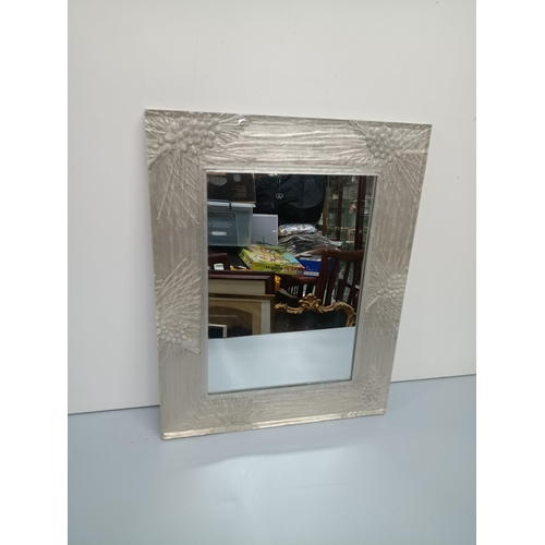 332 - A Modern Wall Hanging Mirror In A Patterned Perspex frame.