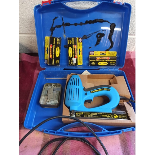 148 - A Nail Master 240v Electric Brad Gun With 3 Packs Of Nails, In Plastic Case.