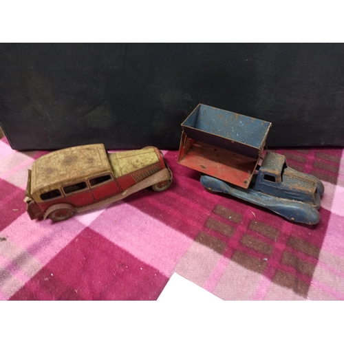 1088 - A Pair Of Tin Plate Toys & A Tipper Truck.