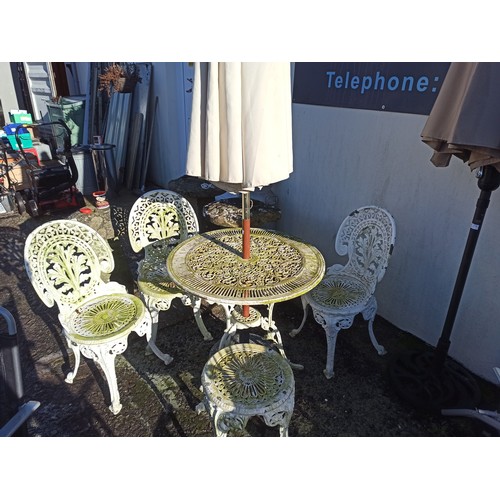 5 - White Cast Aluminium Table and 4 chairs ( 1 with back missing) with Marble parasol holder and cream ... 