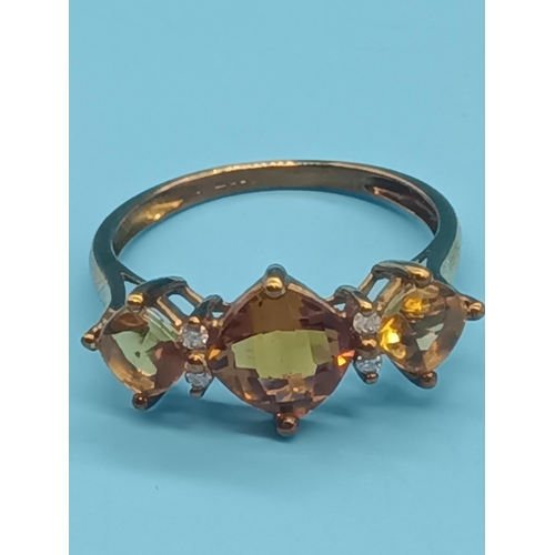 413 - A 9ct Gold Citrine Trilogy Ring