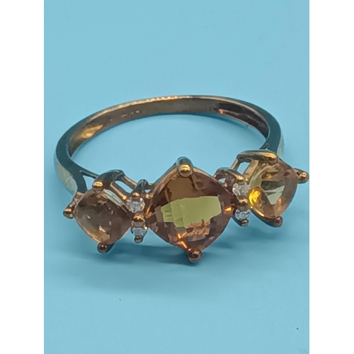 413 - A 9ct Gold Citrine Trilogy Ring