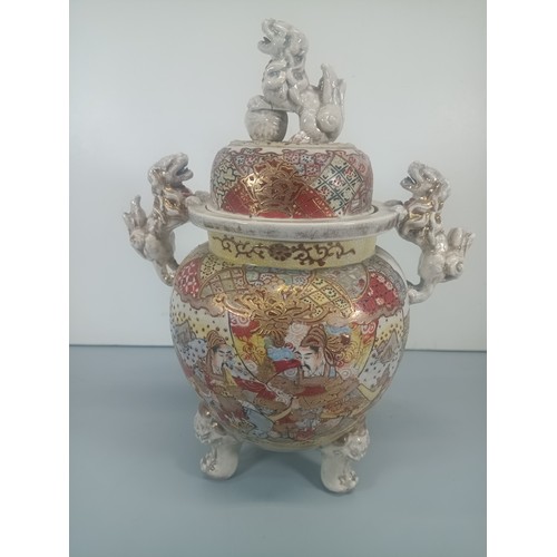 396 - A Japanese Satsuma Meiji Urn adorned with Foo Dogs 36cm High