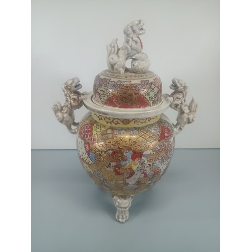 396 - A Japanese Satsuma Meiji Urn adorned with Foo Dogs 36cm High