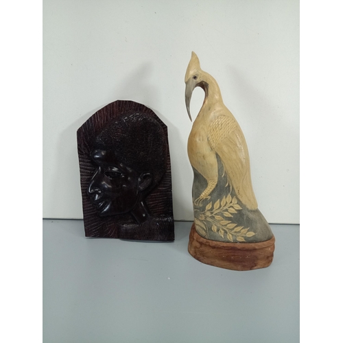 499 - A Carved Water Buffalo Horn Statue of an Egret or Heron and an African Ebonised Wood Carving