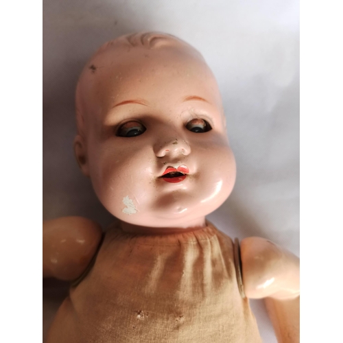 1092 - A Vintage Doll With Cloth Body. A.M Germany On Back Of Neck.