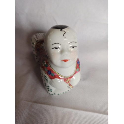 388 - A Vintage Chinese Porcelain Child Ornament.
17cm H x 23cm L x 10cm W