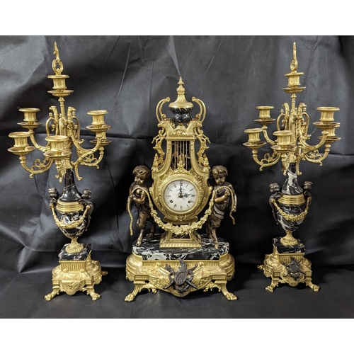 599 - An Italian Imperial Ormolu Triptych composed of Clock and Candelabra Garnitures in Bronze and Black ... 