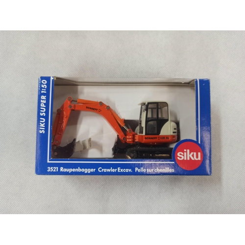 1098 - Siku 3521 Schaeff HML Excavator  Die Cast Model In Original Box & Packaging.