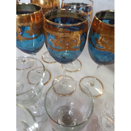 215 - A Large Quantity Of Mixed Glasses including Wine, Brandy, Sherry & More.