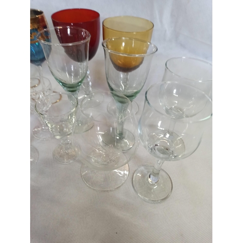 215 - A Large Quantity Of Mixed Glasses including Wine, Brandy, Sherry & More.