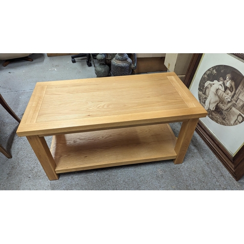 796 - A Modern Light Oak Coffee Table.
50cm x 50cm x 100cm,