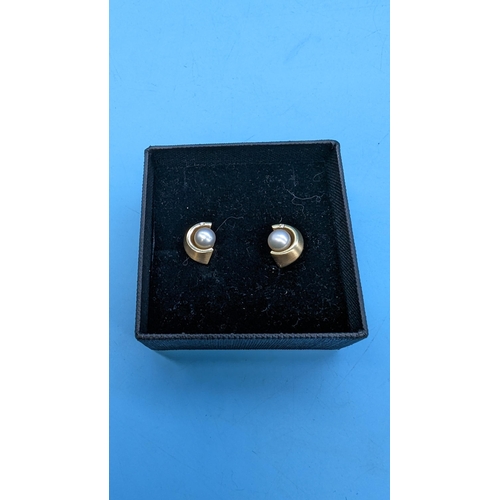 419 - A Pair of 9ct Gold and Peral Earrings with Diamond Accents 3.8 Grams